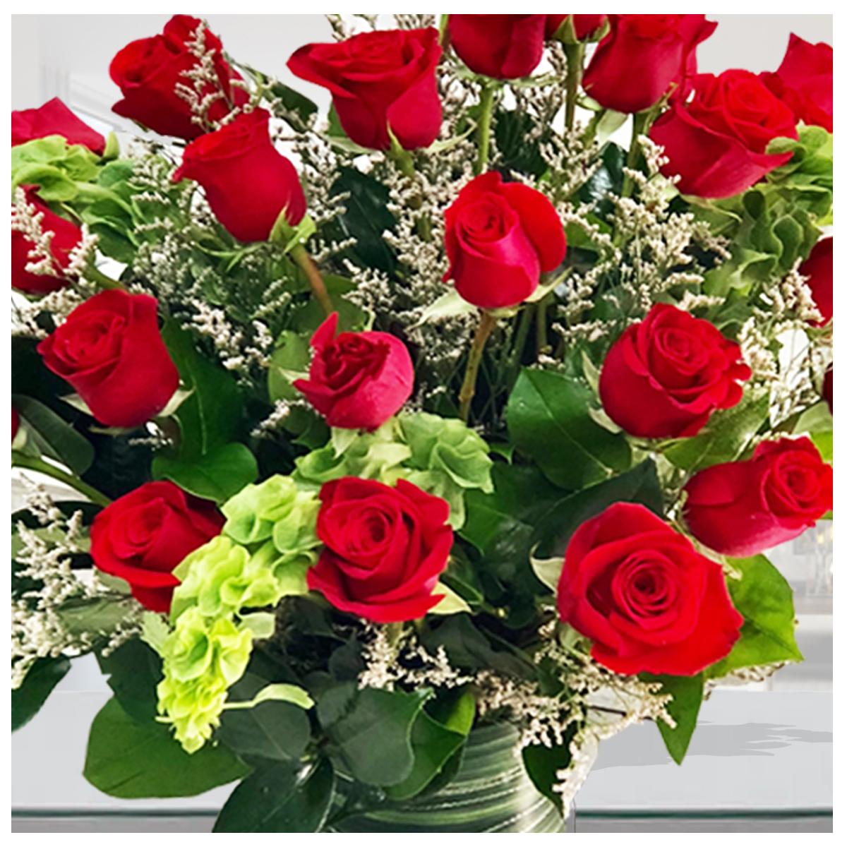 Roses On A Lush Green Bed