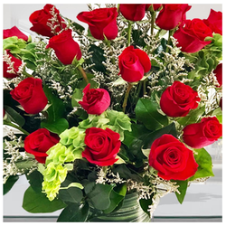 Roses On A Lush Green Bed